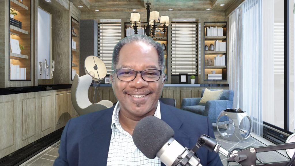 Dr Hamilton at the microphone during a podcast