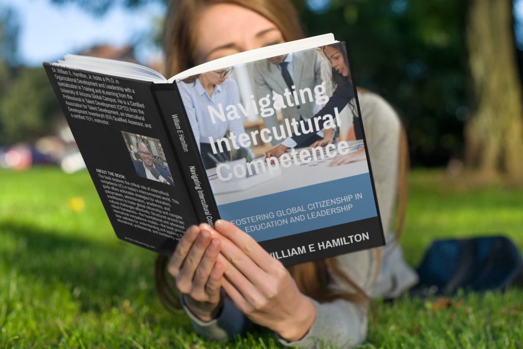 Mockup of a woman reading a paperback book on the grass 3412 el1