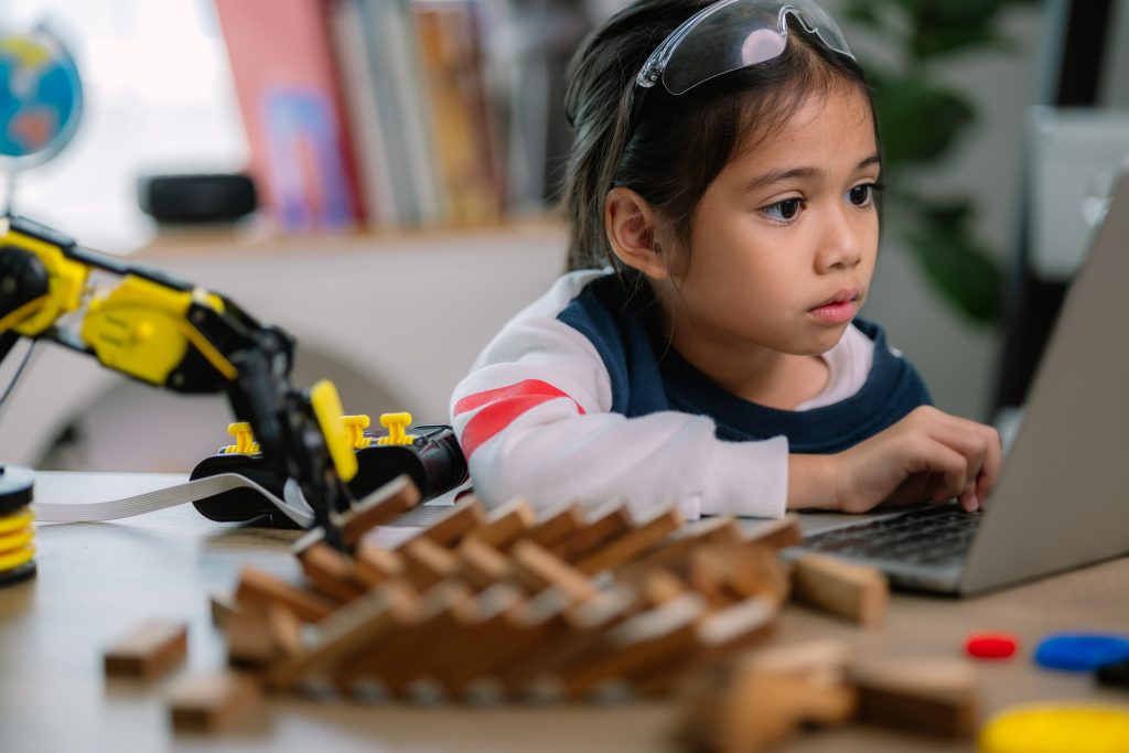 Asian girls were learning robot programming and getting lessons